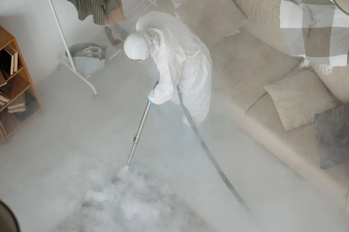 Biohazard cleanup technician in protective equipment, Glasgow, MT